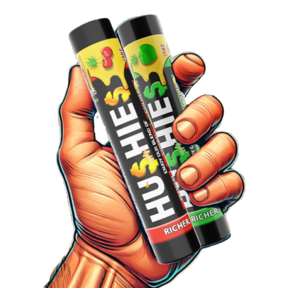 A hand holding two cans of hushie.